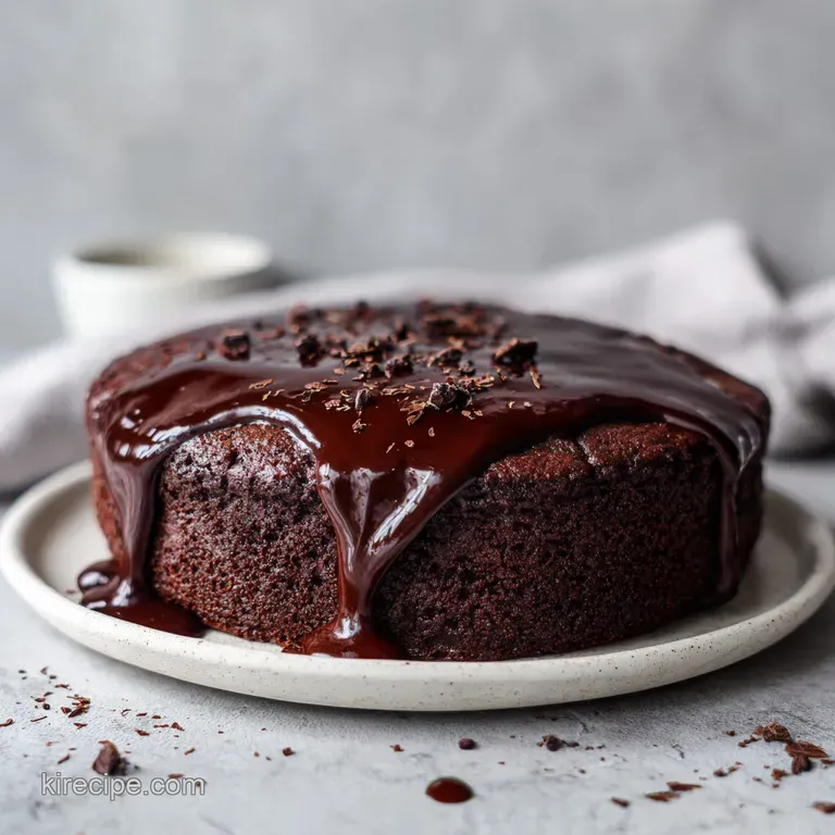 A generous slice of chocolate cake with whipped cream and a caramel drizzle on a white plate.