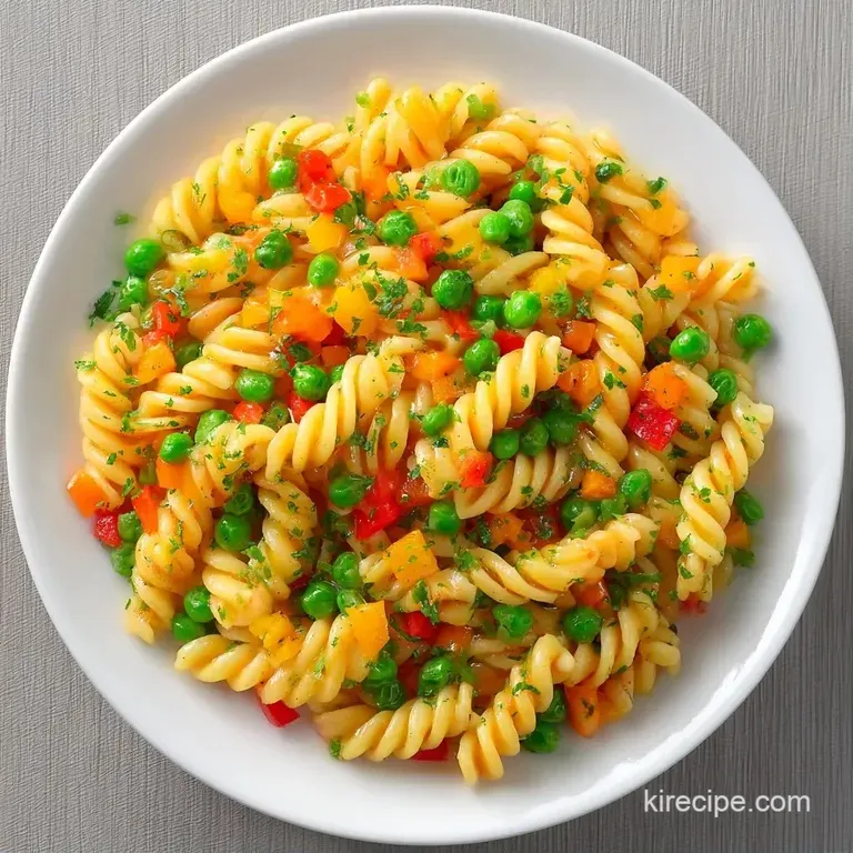 A white ceramic bowl filled with multicolored pasta and bright vegetables, topped with a sprinkle of fresh parsley.